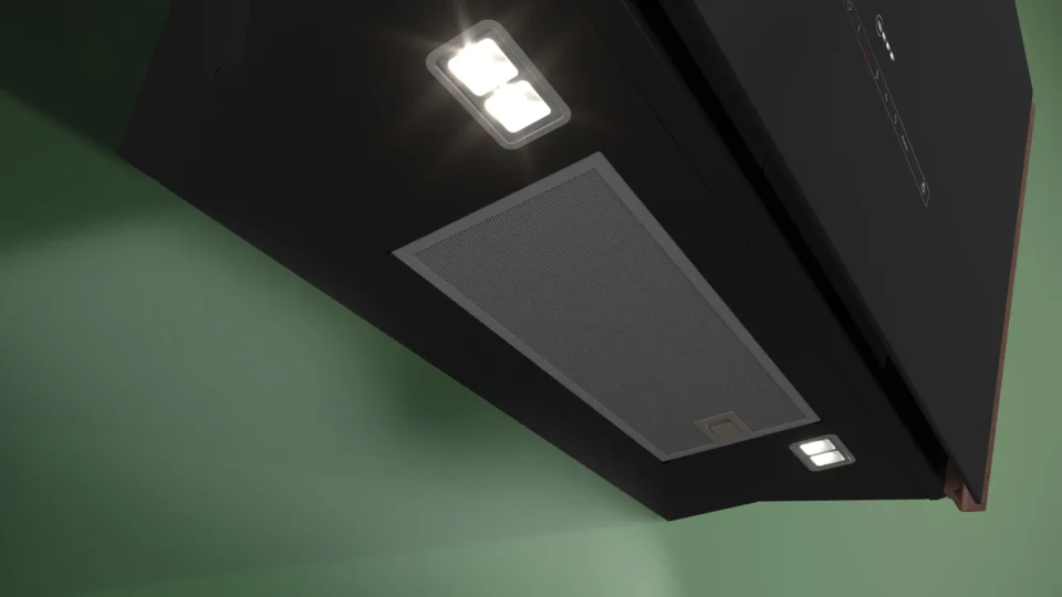 Eine schwarze Dunstabzugshaube mit zwei eingeschalteten LED-Lichtern ist an einer grünen Wand montiert. In der Mitte befindet sich ein rechteckiger Filter.
